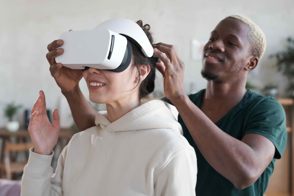 Man showing virtual reality to woman